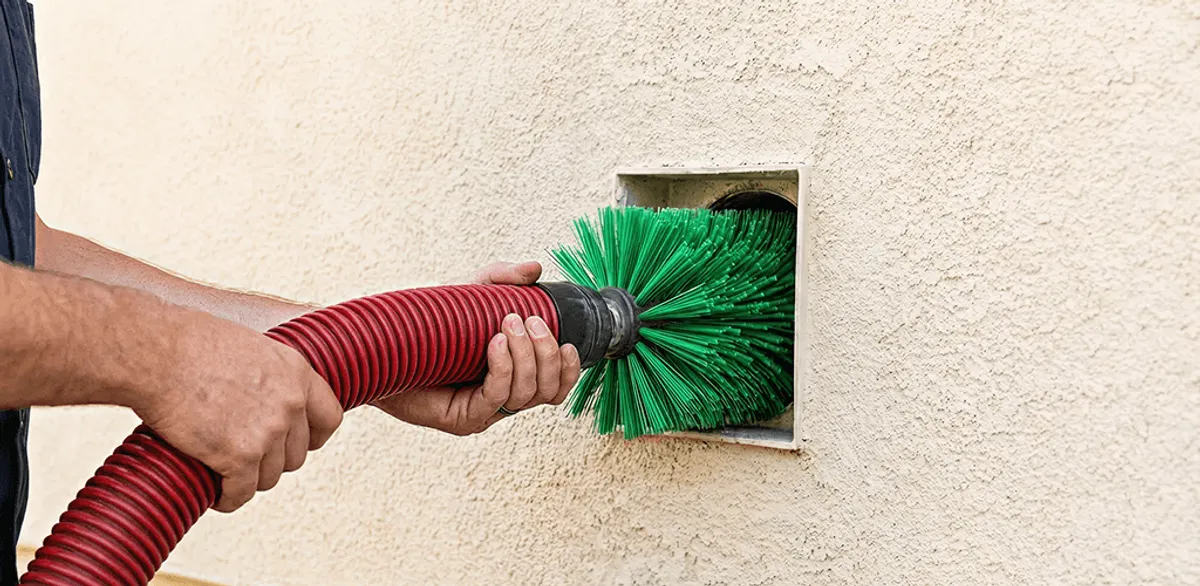 Air duct cleaning brush removing debris from a vent opening in Las Vegas, NV
