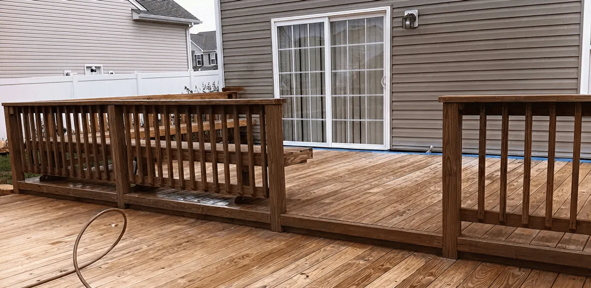 Deck sealing service protecting a backyard wood deck and railings in Las Vegas, NV
