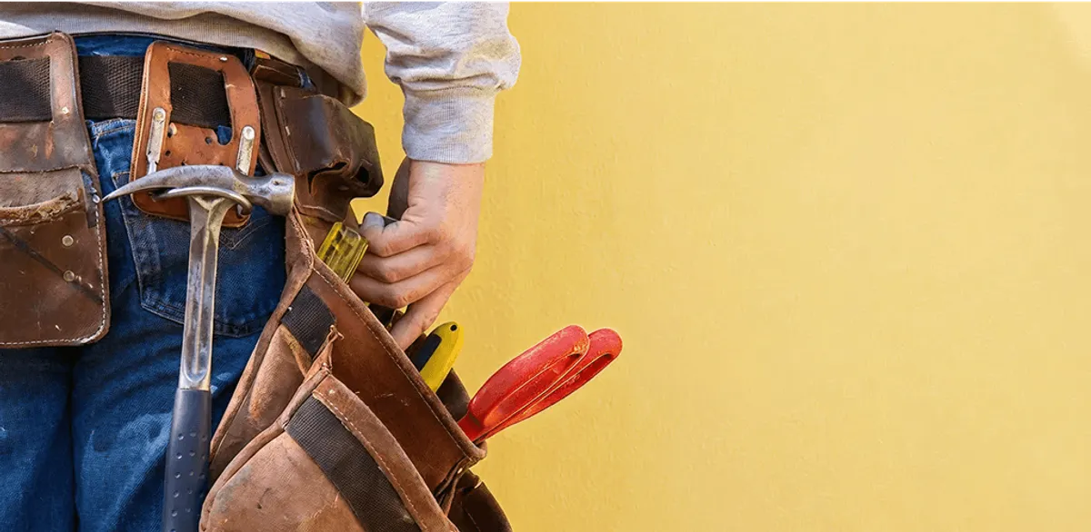 Handyman with tool belt ready for home repairs and maintenance in Las Vegas, NV