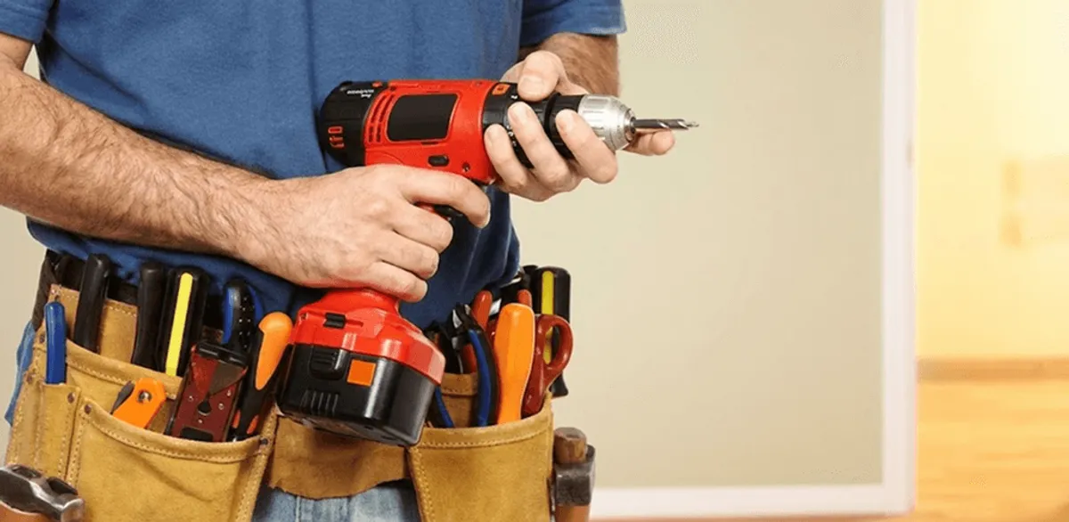 Handyman holding a power drill for home repairs and installations in Las Vegas, NV