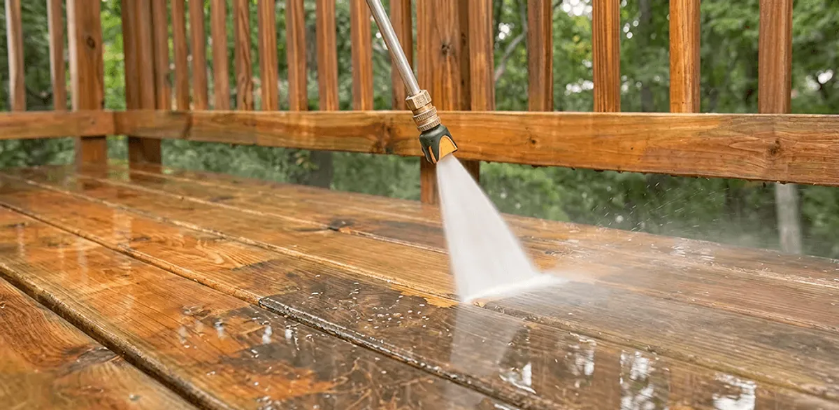 Pressure washing a wood deck to remove dirt and buildup in Las Vegas, NV